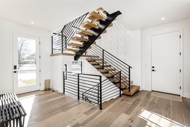 foyer entrance with light hardwood / wood-style flooring