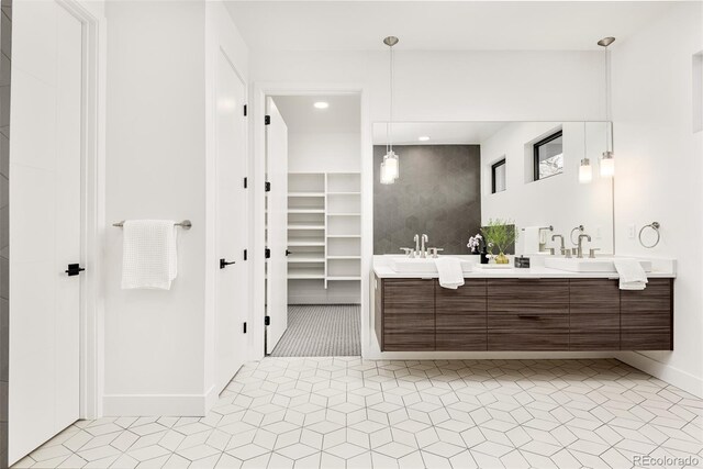 bathroom featuring tile patterned flooring and vanity