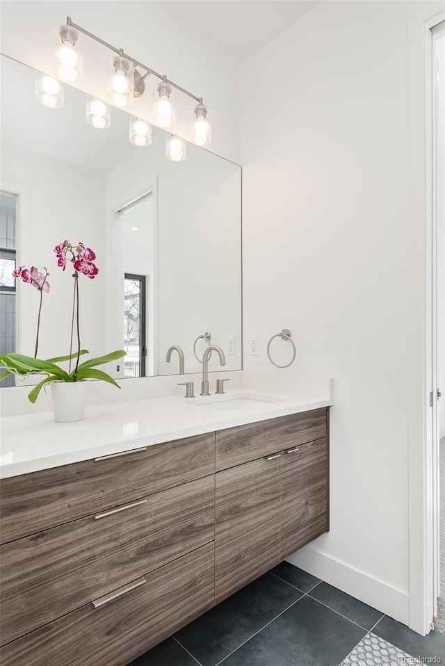 bathroom with tile patterned flooring and vanity