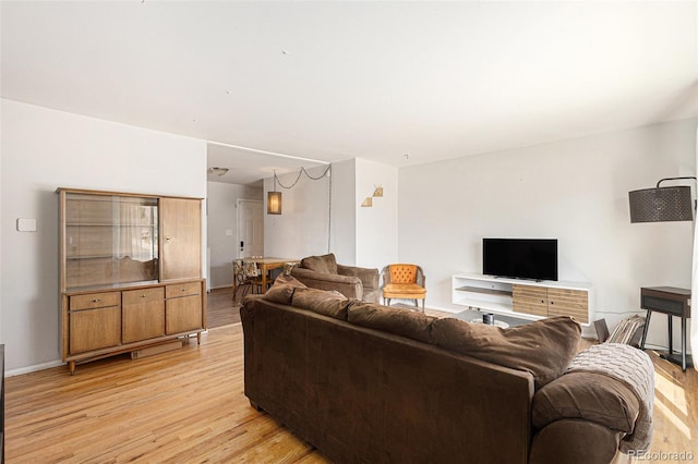 2514 E Bijou St, Colorado Springs, CO 80909 - living room with light wood-type flooring and baseboards