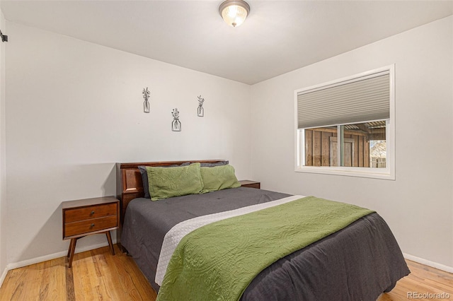 2514 E Bijou St, Colorado Springs, CO 80909 - bedroom featuring light wood-type flooring and baseboards
