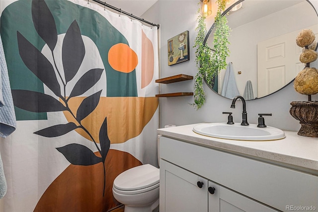 2514 E Bijou St, Colorado Springs, CO 80909 - bathroom with toilet, vanity, and a shower with shower curtain