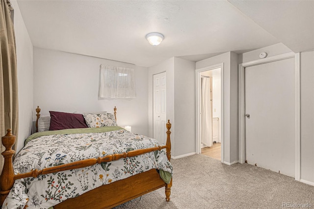2514 E Bijou St, Colorado Springs, CO 80909 - bedroom featuring light carpet, baseboards, and a closet
