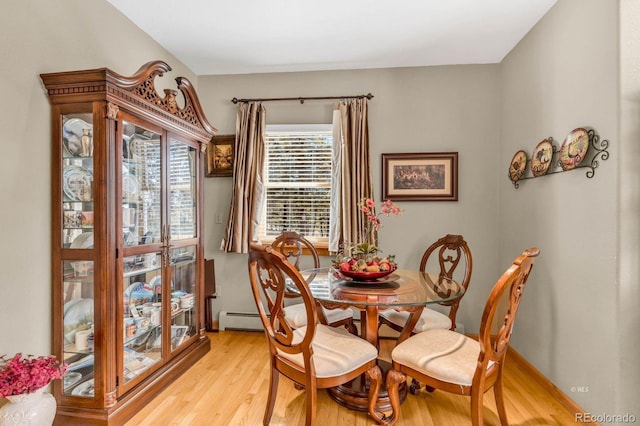 31 Black Fawn Ln, Westcliffe, CO 81252 - dining space with baseboards, a baseboard heating unit, and light wood-style floors