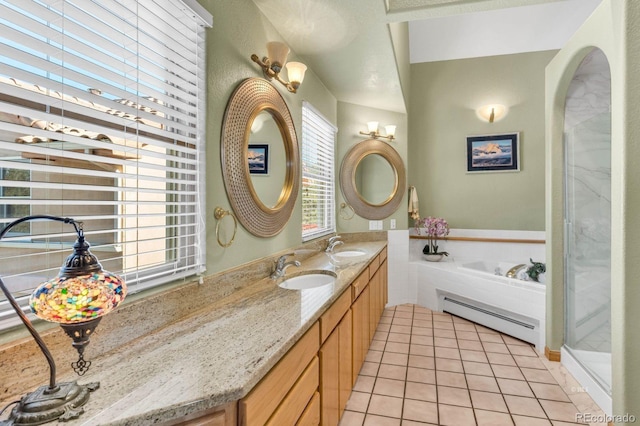 31 Black Fawn Ln, Westcliffe, CO 81252 - full bathroom with a sink, tile patterned flooring, a bath, a baseboard heating unit, and double vanity