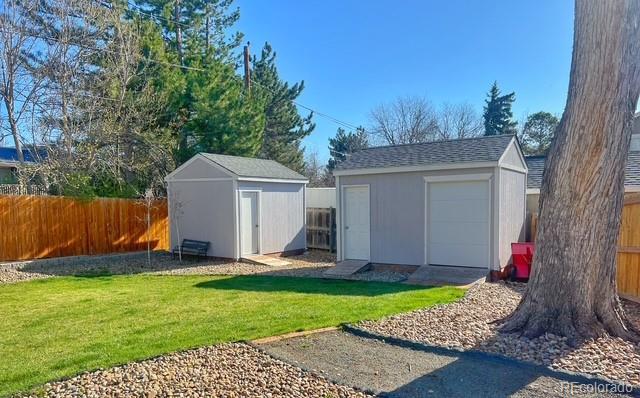 view of shed with fence