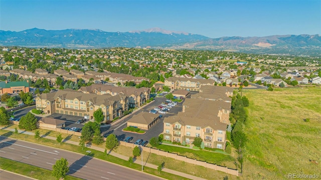 birds eye view of property featuring a mountain view