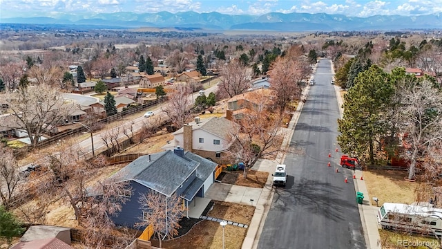 drone / aerial view featuring a residential view and a mountain view