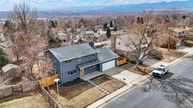 bird's eye view featuring a residential view and a mountain view