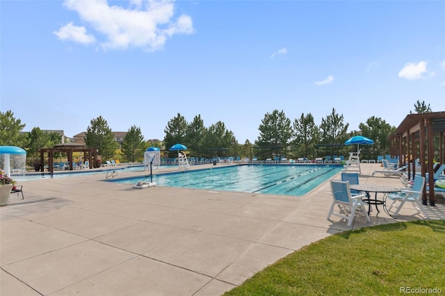 view of swimming pool with a gazebo, a patio, and pool water feature