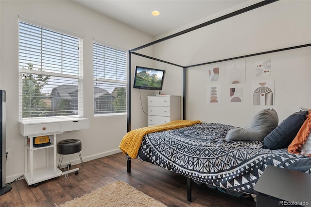 bedroom featuring dark hardwood / wood-style flooring