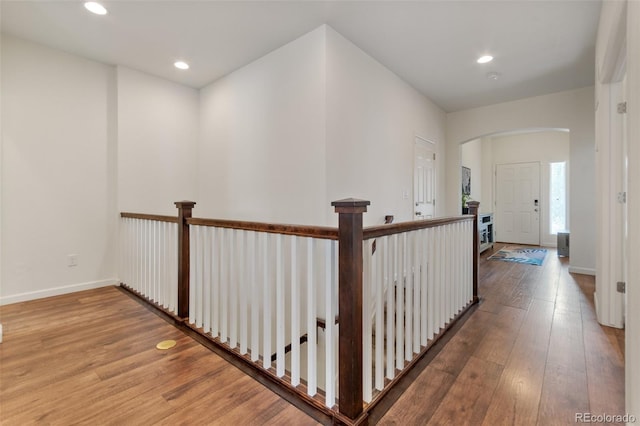 hall with hardwood / wood-style flooring