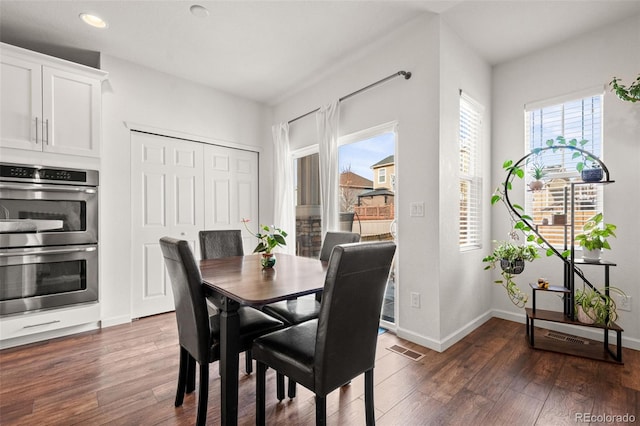 dining room with baseboards, visible vents, dark wood-style flooring, and recessed lighting