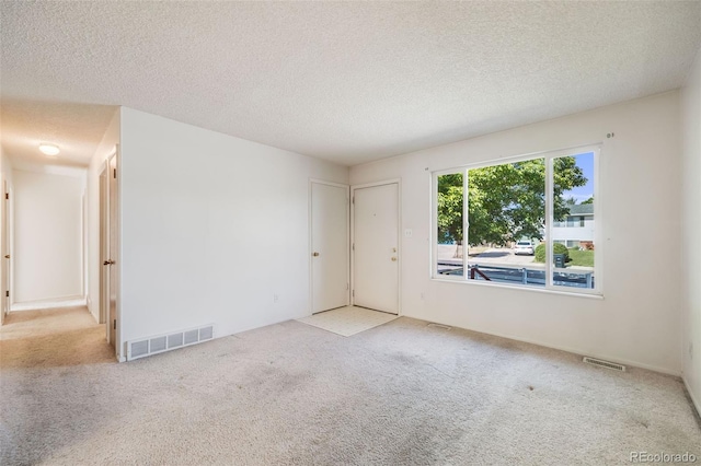 12218 Monroe Dr, Thornton, CO 80241 - spare room featuring carpet floors and a textured ceiling