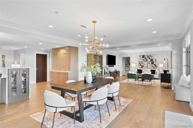 1590 Little Raven St Unit 408, Denver, CO 80202 - dining room featuring ornamental molding, light wood-type flooring, visible vents, and recessed lighting