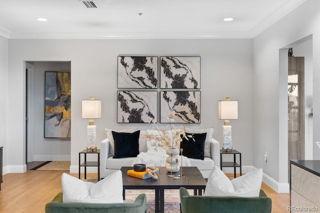 1590 Little Raven St Unit 408, Denver, CO 80202 - living room featuring light wood-style floors, visible vents, and ornamental molding