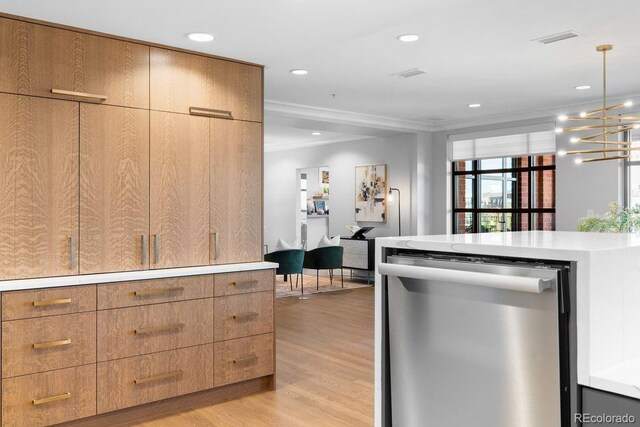 1590 Little Raven St Unit 408, Denver, CO 80202 - kitchen featuring light wood-type flooring, light countertops, crown molding, and dishwasher