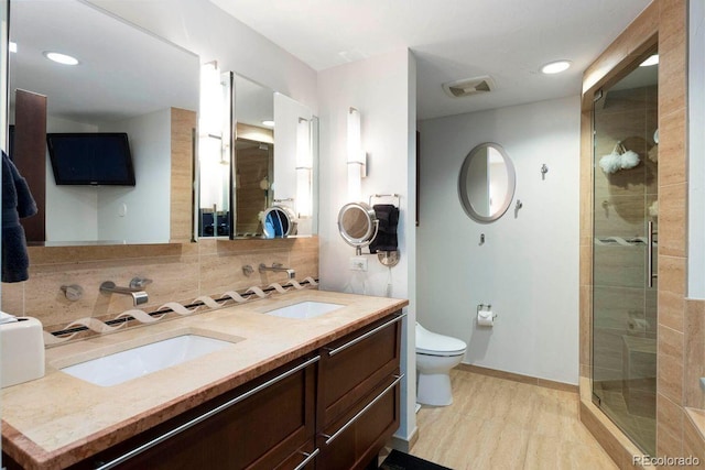 1590 Little Raven St Unit 408, Denver, CO 80202 - full bath featuring a stall shower, tasteful backsplash, visible vents, and a sink