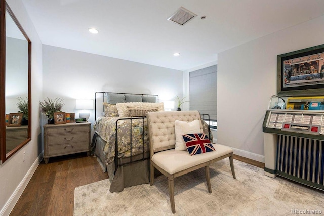 1590 Little Raven St Unit 408, Denver, CO 80202 - bedroom with visible vents, wood finished floors, and baseboards