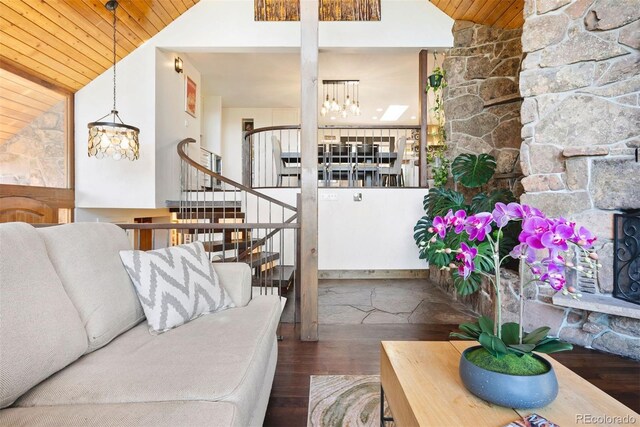 2976 Hiwan Dr, Evergreen, CO 80439 - living room with lofted ceiling, wooden ceiling, a chandelier, wood finished floors, and stairs