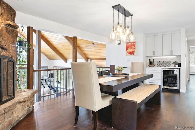 2976 Hiwan Dr, Evergreen, CO 80439 - dining room with wine cooler and dark wood-style floors