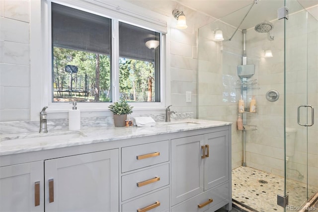 2976 Hiwan Dr, Evergreen, CO 80439 - full bathroom with a shower stall and double vanity