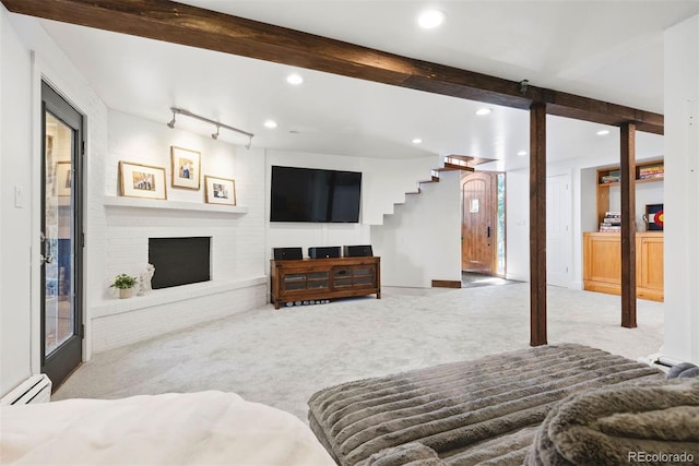2976 Hiwan Dr, Evergreen, CO 80439 - carpeted living room with baseboard heating, recessed lighting, beamed ceiling, and a brick fireplace