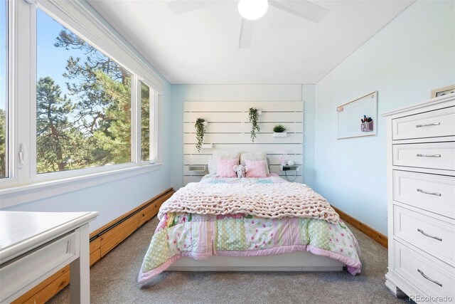2976 Hiwan Dr, Evergreen, CO 80439 - bedroom with baseboard heating, carpet floors, and a ceiling fan