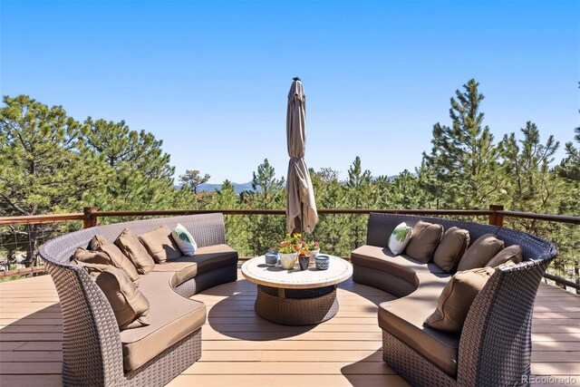 2976 Hiwan Dr, Evergreen, CO 80439 - wooden terrace with outdoor lounge area