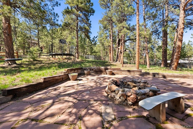 2976 Hiwan Dr, Evergreen, CO 80439 - view of patio / terrace with an outdoor fire pit and fence