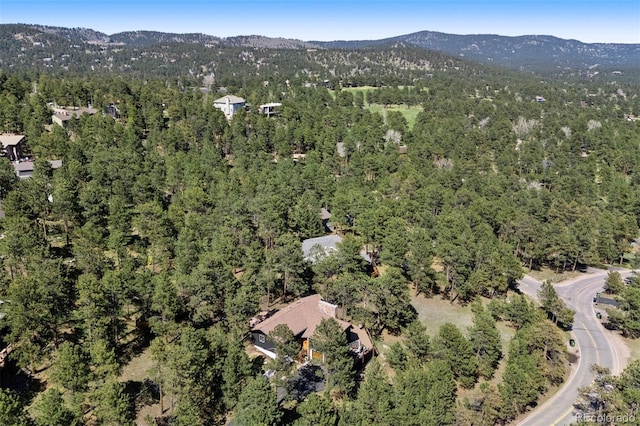 2976 Hiwan Dr, Evergreen, CO 80439 - aerial view of property's location with a heavily wooded area and mountains