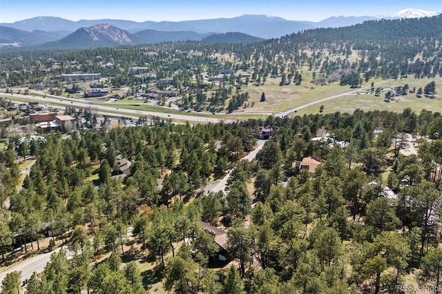 2976 Hiwan Dr, Evergreen, CO 80439 - aerial view of property and surrounding area with mountains and a heavily wooded area