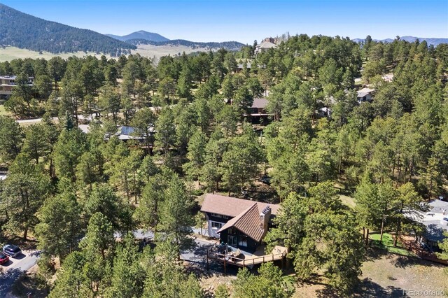 2976 Hiwan Dr, Evergreen, CO 80439 - aerial view of a heavily wooded area and mountains