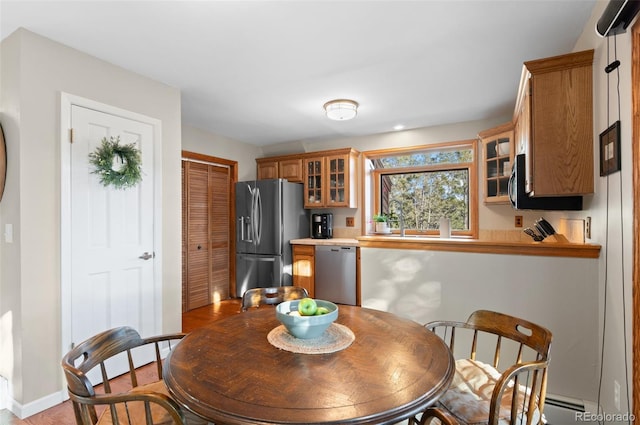 dining area featuring baseboards