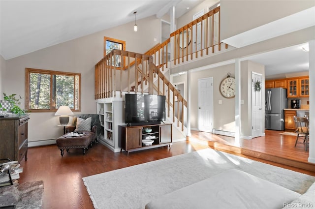 living room with baseboards, a baseboard radiator, dark wood-style flooring, stairs, and high vaulted ceiling