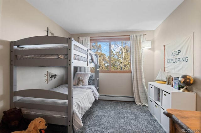 bedroom featuring a baseboard heating unit and dark carpet