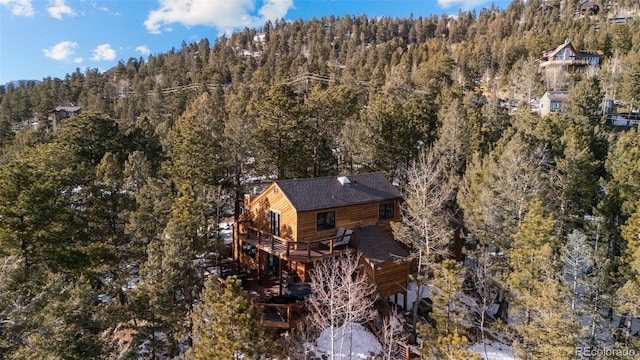 drone / aerial view featuring a view of trees