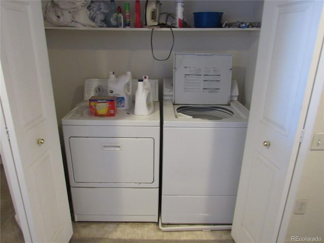 washroom featuring laundry area and washing machine and clothes dryer