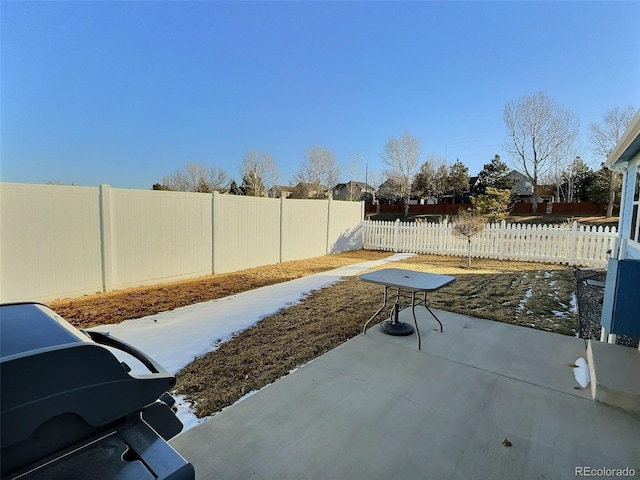 view of patio with a grill