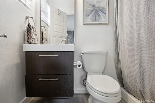 bathroom with vanity, toilet, and a shower with curtain