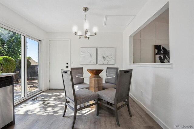 9222 Albion St, Thornton, CO 80229 - dining area featuring wood finished floors and a chandelier