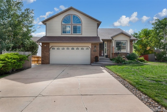 front facade with a front lawn and a garage