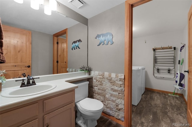 bathroom featuring hardwood / wood-style floors, vanity, and toilet