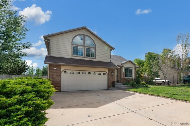 front facade featuring a garage and a front lawn