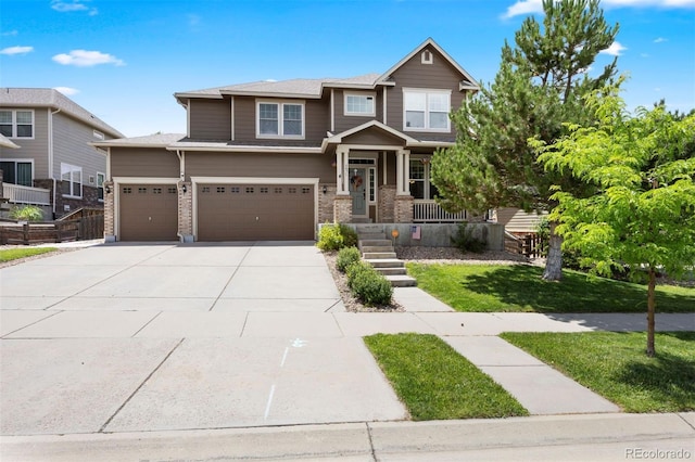 6471 S Ider St, Aurora, CO 80016 - craftsman-style home featuring driveway, an attached garage, a porch, and a front lawn