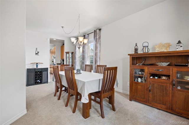 6471 S Ider St, Aurora, CO 80016 - dining room with a chandelier and light colored carpet