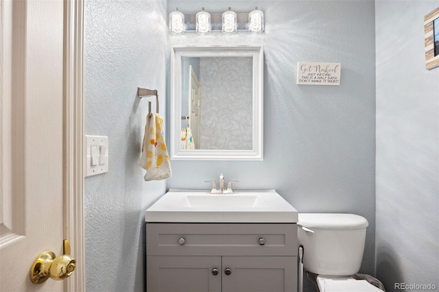 6471 S Ider St, Aurora, CO 80016 - bathroom with vanity and a textured wall
