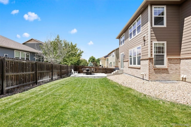 6471 S Ider St, Aurora, CO 80016 - fenced backyard with a patio area