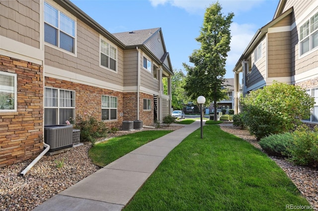 view of property's community with a yard
