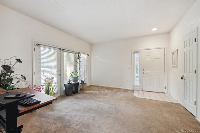 carpeted office space with baseboards